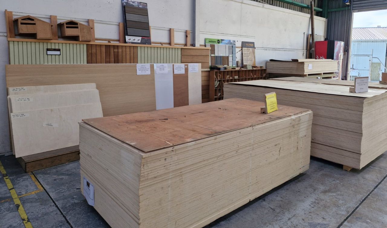 Picture of a stack of plywood inside the warehouse